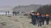 Dozens, including children, drown after refugee ship breaks apart in rough seas off Italian coast