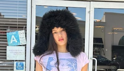Rosalía Wears a Shearling Trapper Hat to Hilariously Hunt Down Her Dior Billboard