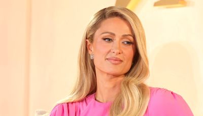 Paris Hilton says she wore a prosthetic baby bump while a surrogate carried her child