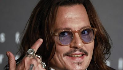 Johnny Depp parties in the Caribbean, but no longer has teeth of a pirate