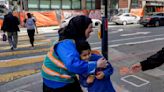 With a vest and a voice, helpers escort kids through San Francisco’s broken Tenderloin streets