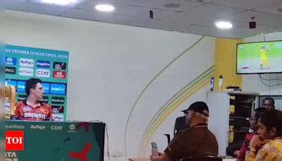 Watch: Pat Cummins spotted watching MS Dhoni's batting during press conference, video goes viral | Cricket News - Times of India