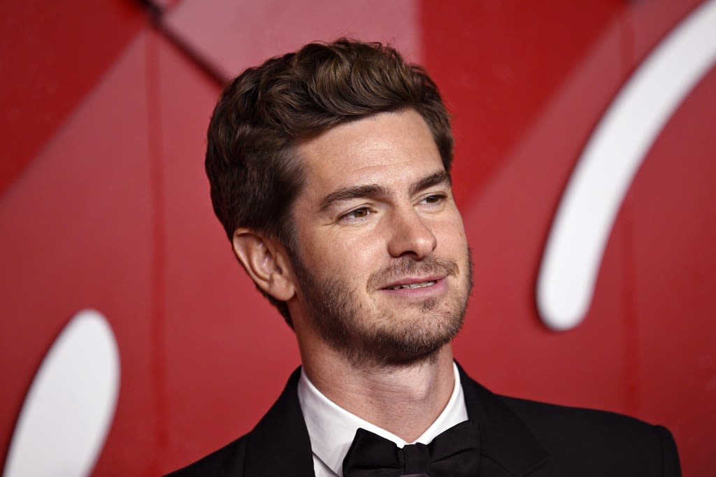 Andrew Garfield’s professional witch girlfriend denies putting spell on him