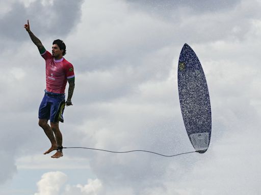 Brazilian surfer Gabriel Medina appears to walk on water, and other photos from Monday and Tuesday at the 2024 Paris Olympics