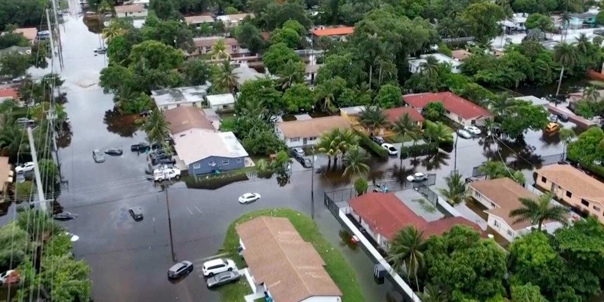 Tropical rainstorms in South Florida lead to flight delays and streets jammed with stalled cars