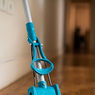 A mop with a sponge head that is used for cleaning floors Usually comes with a wringer to remove excess water from the sponge Effective in cleaning spills and stains on hard floors