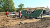 Volunteers help raise walls for construction of a new space for an area church