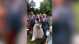 Heartwarming moment both father and stepfather walk bride down aisle together