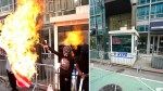 The moment masked anti-Israel protesters set fire to American flags outside Israeli consulate