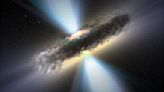 Star-birthing galaxies can hide supermassive black holes behind walls of dust