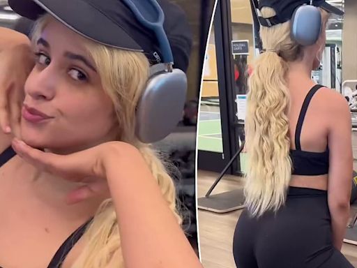 Camila Cabello shows her toned tummy in a black sports bra at the gym