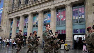 Olympics opening ceremony latest: Paris Games off to rough start with rail attack, gray skies