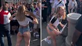Female fan flashes huge crowd of England supporters then gets handshake from man