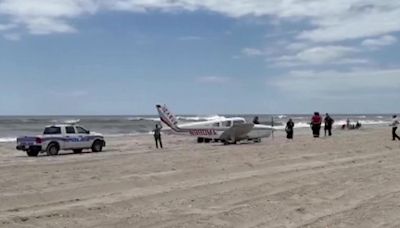 Small plane lands on beach on New York's Fire Island