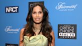 Padma Lakshmi, in white bikini, shows off stretch marks as she plays in a pool