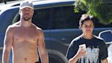 Derek Hough flaunts his his well-built torso as he walks shirt-free