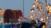 Collapsed Baltimore bridge span comes down