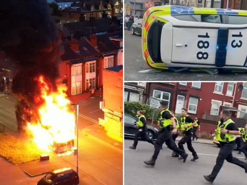 Bus set on fire and police car flipped over as riot breaks out in Leeds with hundreds out on streets