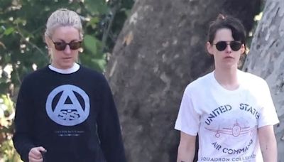 Kristen Stewart flashes her trim tummy in a white crop top as she and fiancée Dylan Meyer enjoy a walk in Los Angeles