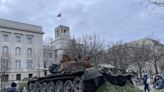 Two Germans parked a mangled Russian tank in front of the Russian embassy in Berlin as an anniversary gift