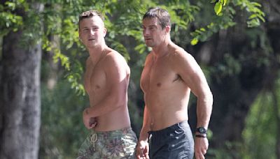 Shirtless Bear Grylls hits the beach in Costa Rica with his son