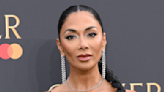 Nicole Scherzinger Shows Off Long Legs in Satin Gown