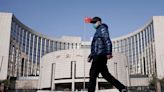 Chinese money flows into bonds even as central bank warns of risks