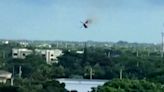 Helicopter crashes into apartment building, killing 2 people, in scene caught on camera