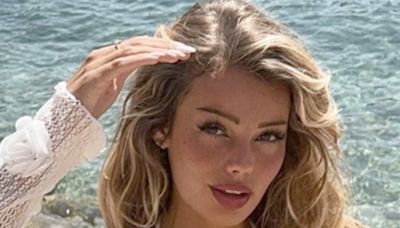 Laura Celia shows off her incredible figure in a plunging white bikini