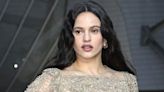 Rosalía goes braless and *almost* frees the nip in a lace naked dress