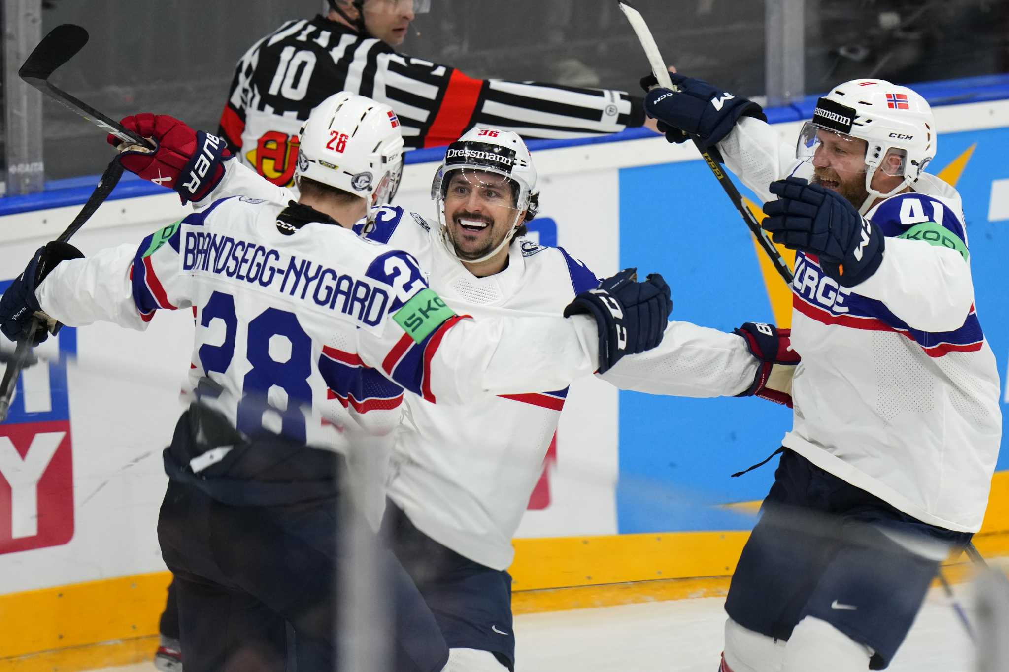 Latvia beats Kazakhstan 2-0 at hockey worlds. Norway tops Denmark