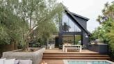 A Sun-Drenched Kitchen and Outdoor Deck Flow Seamlessly in This Waterside Remodel