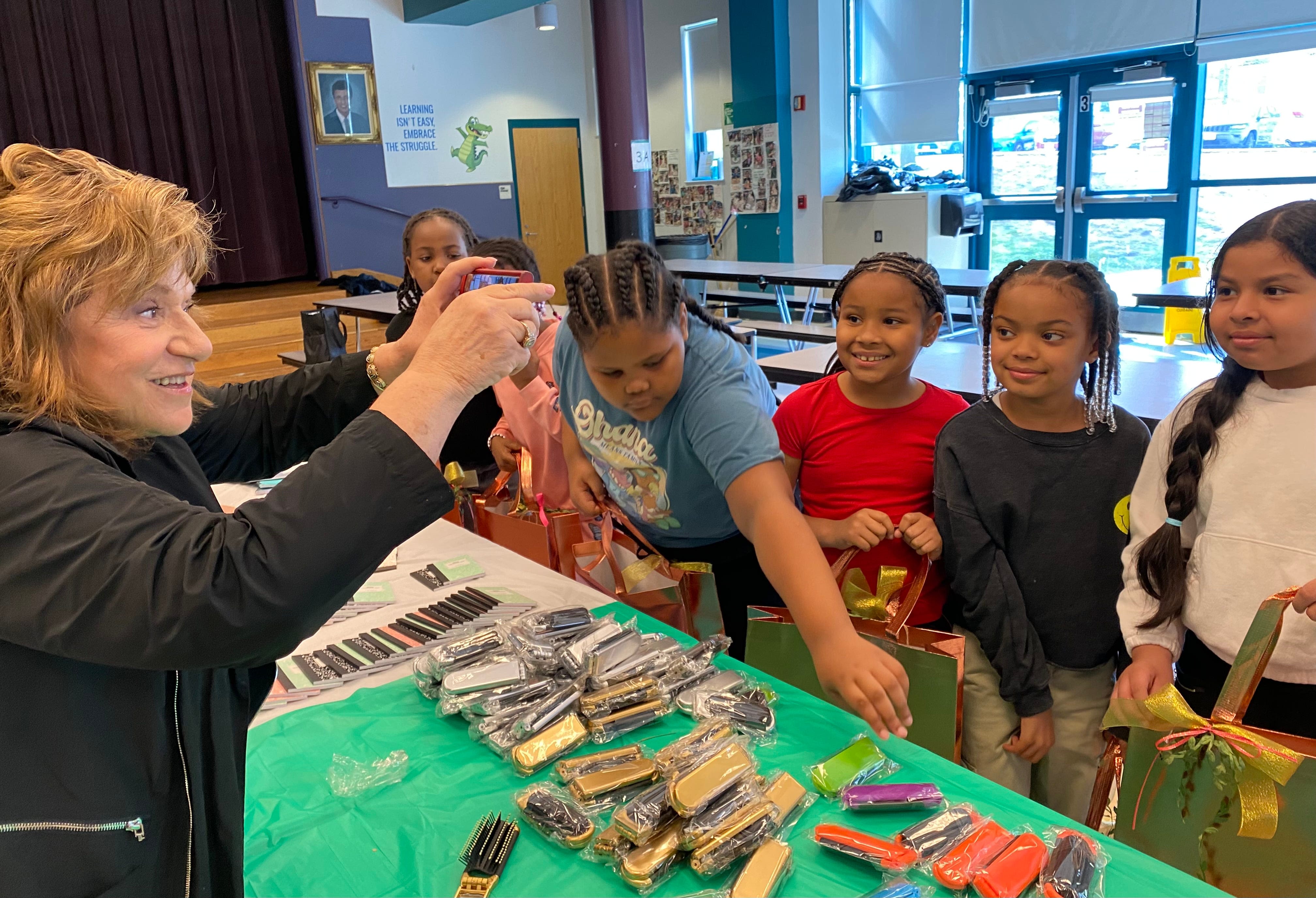 Brockton Charity Guild helps Angelo Elementary School kids make gift bags for Mother's Day