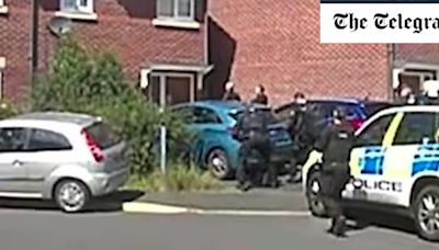 Southport attack latest: Moment masked figure paces outside house raided by police