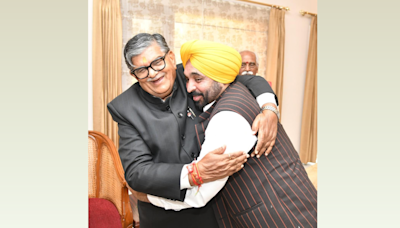 CM Mann hugs new Punjab governor as his wife touches his feet