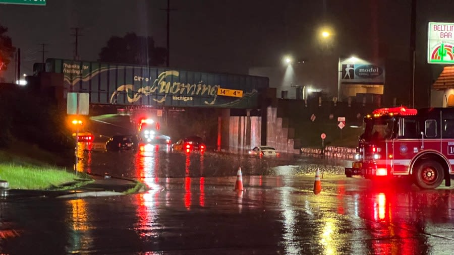 Cars under water after part of S. Division Avenue floods