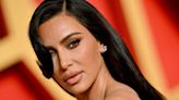Kim Kardashian Flaunts Her Assets in Tiny Snakeskin-Print String Bikini