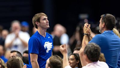 ...Kentucky signee Travis Perry is honored while new Kentucky basketball head coach Mark Pope speaks during Pope's introductory event at Rupp Arena. Perry is the only original 2024...