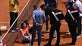 Italian Open protesters glued themselves to the stands as police called