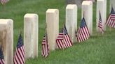 Thousands of American flags are placed on gravesites at Miramar National Cemetery