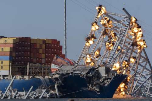 Baltimore bridge comes down with a boom after crews set off explosives