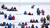 Bills, Steelers fans dig through waist deep snow, slide down walkways to find seats