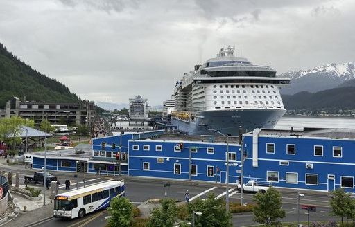 A new agreement would limit cruise passengers in Alaska's capital. A critic says it falls short