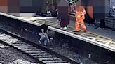 Heart-stopping moment boy, 3, falls on railway line before train thunders past