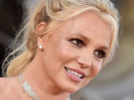 Britney Spears shared a photo of her bruised ankle and said she felt 'harassed' after paramedics responded to a 911 call to her hotel