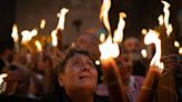 Cheers and flames as Orthodox worshipers greet the ancient ceremony of the 'Holy Fire'