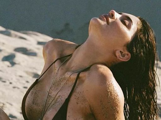 Kylie Jenner is covered in sand in bikini-clad dune snaps