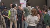 Protesting MIT students march through Cambridge, block faculty garage