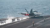 A US Navy carrier strike group locked in a Red Sea battle has fired over 500 munitions fighting the Houthis
