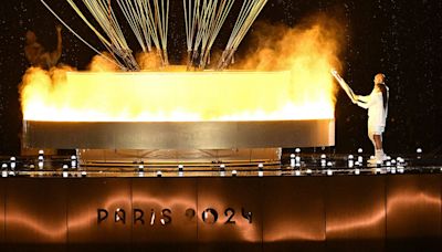 French Olympic heroes Marie-José Pérec, Teddy Riner light cauldron to kick off Paris games